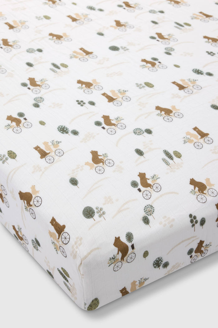 Loulou Lollipop muslin fitted crib sheet in Bears on Bikes for US standard crib — front view on white background