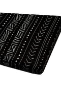 Loulou Lollipop muslin fitted crib sheet in Black Mudcloth for US standard crib — front view on white background