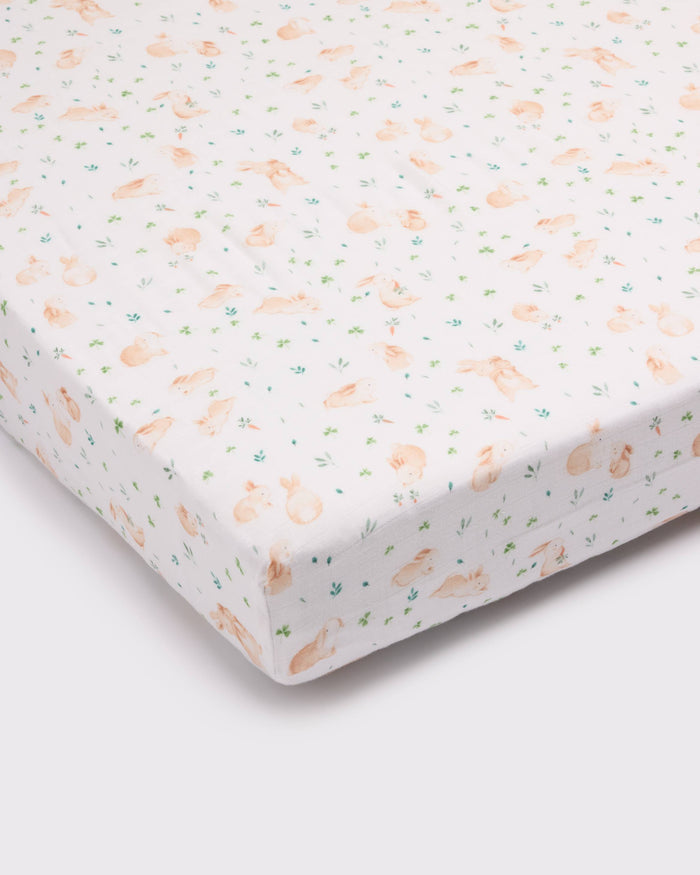 Loulou Lollipop muslin fitted crib sheet in Bunny Meadow for US standard crib — front view on white background