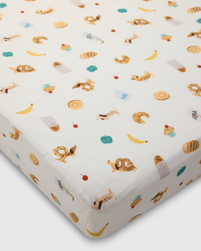Loulou Lollipop muslin fitted crib sheet in French Breakfast for US standard crib — front view on white background