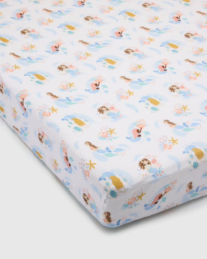 Loulou Lollipop muslin fitted crib sheet in Mermaids for US standard crib — front view on white background