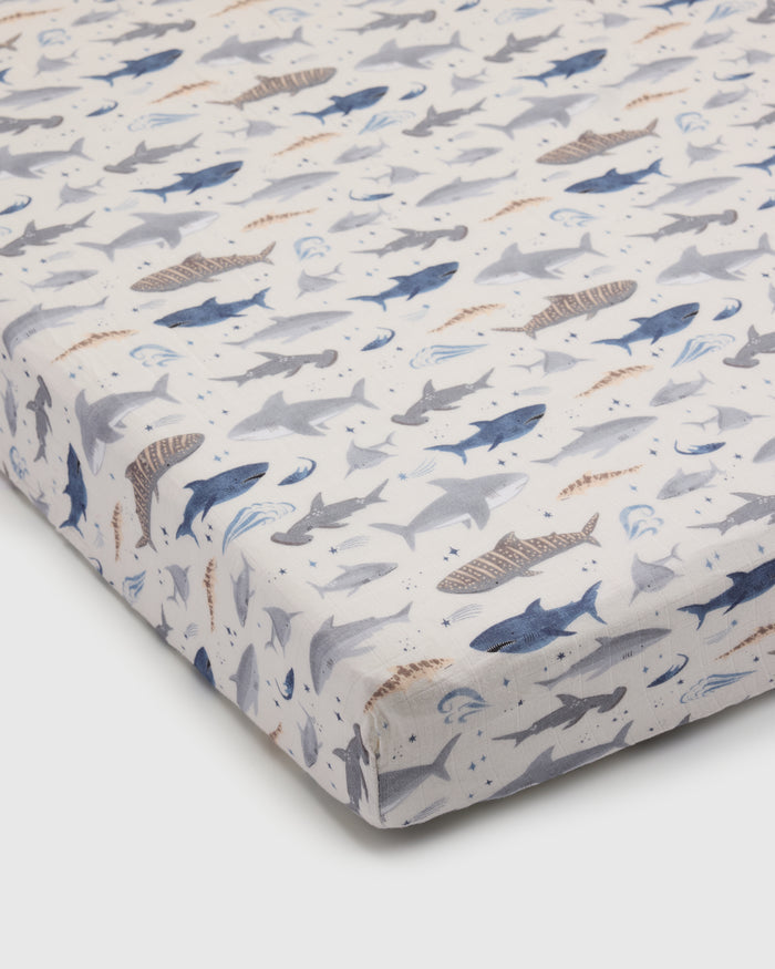 Loulou Lollipop muslin fitted crib sheet in Smiley Sharks for US standard crib — front view on white background