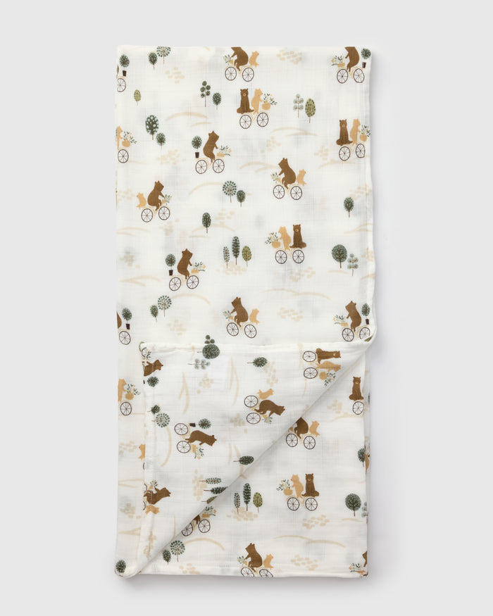 Loulou Lollipop bamboo cotton muslin swaddle blanket in Bears on Bikes — front view on white background