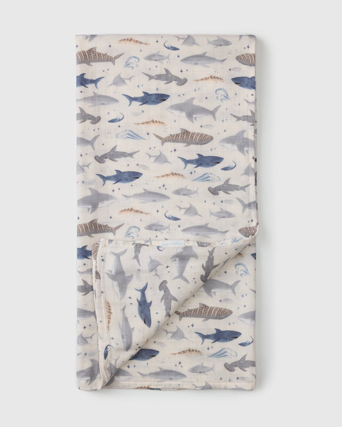 Loulou Lollipop bamboo cotton muslin swaddle blanket in Smiley Sharks — front view on white background