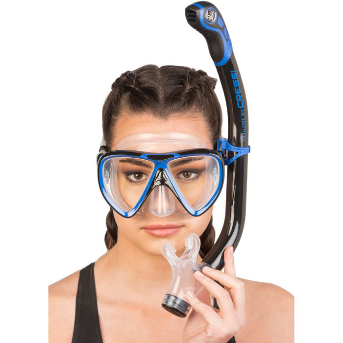Woman wearing black and blue snorkelling combo.