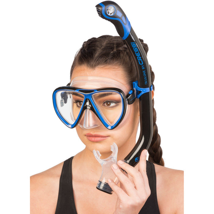 Woman wearing black and blue snorkelling combo.