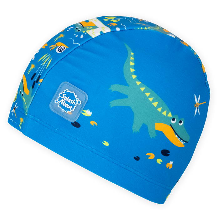 Baby swim hat in blue featuring crocodiles themed print.
