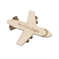 A wooden airplane-shaped decorative item with the engraved text 'My First flight' on a plain white background.