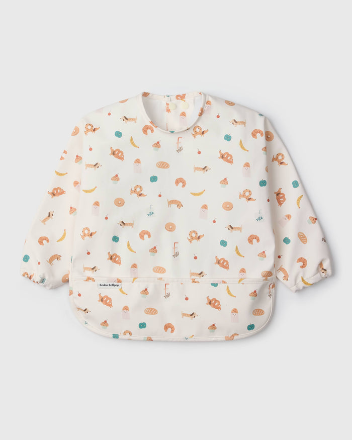 Loulou Lollipop Long Sleeve Bib in French Breakfast — front view on white background