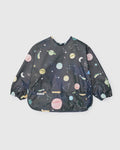 Loulou Lollipop Long Sleeve Bib in Planets — front view on white background