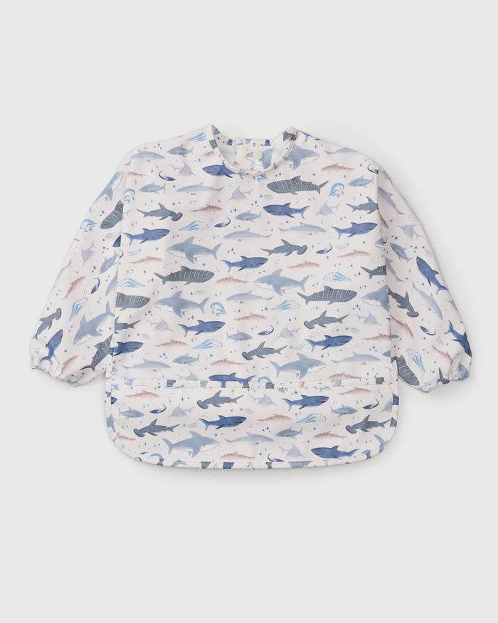 Loulou Lollipop Long Sleeve Bib in Smiley Sharks — front view on white background