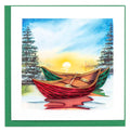 A handcrafted greeting card with a quilled design depicting two red and green river canoes on a body of water, with a blue sky and sun in the background.