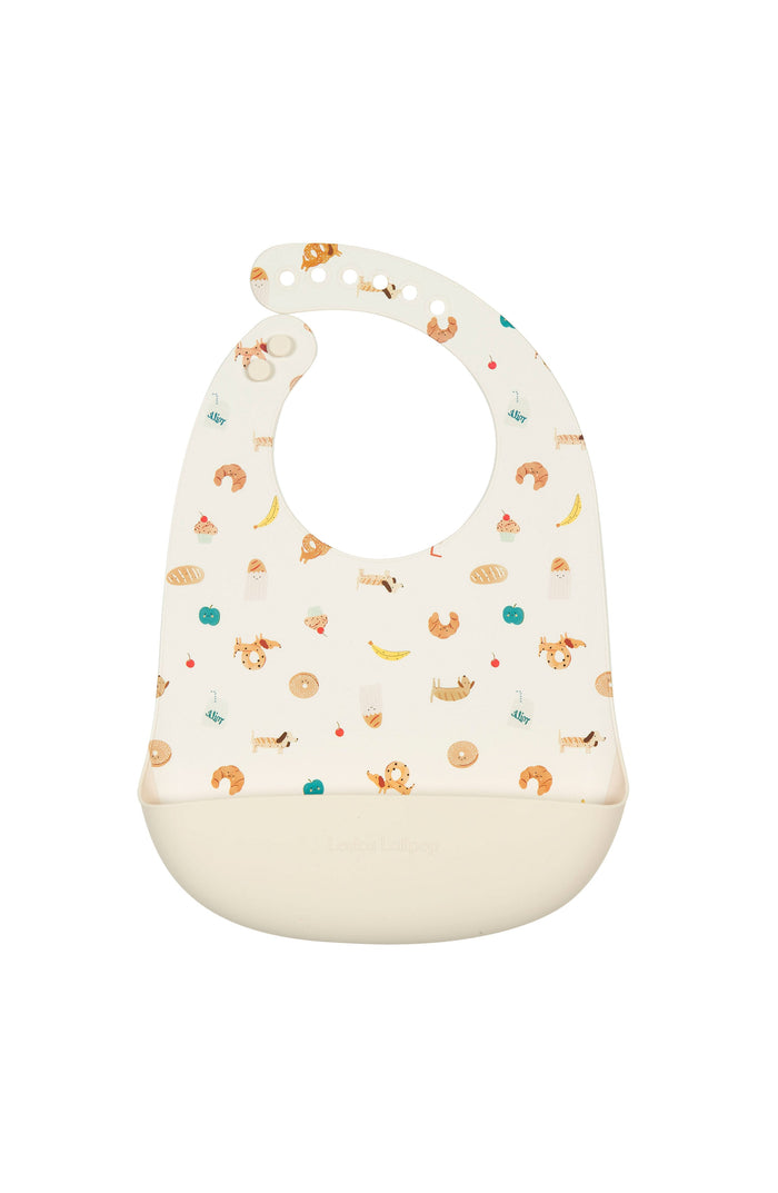 Loulou Lollipop FDA-compliant food-grade silicone baby bib in French Breakfast — front view on white background