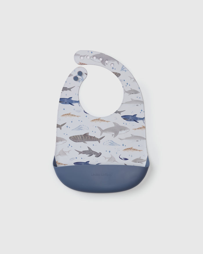Loulou Lollipop FDA-compliant food-grade silicone baby bib in Smiley Sharks — front view on white background
