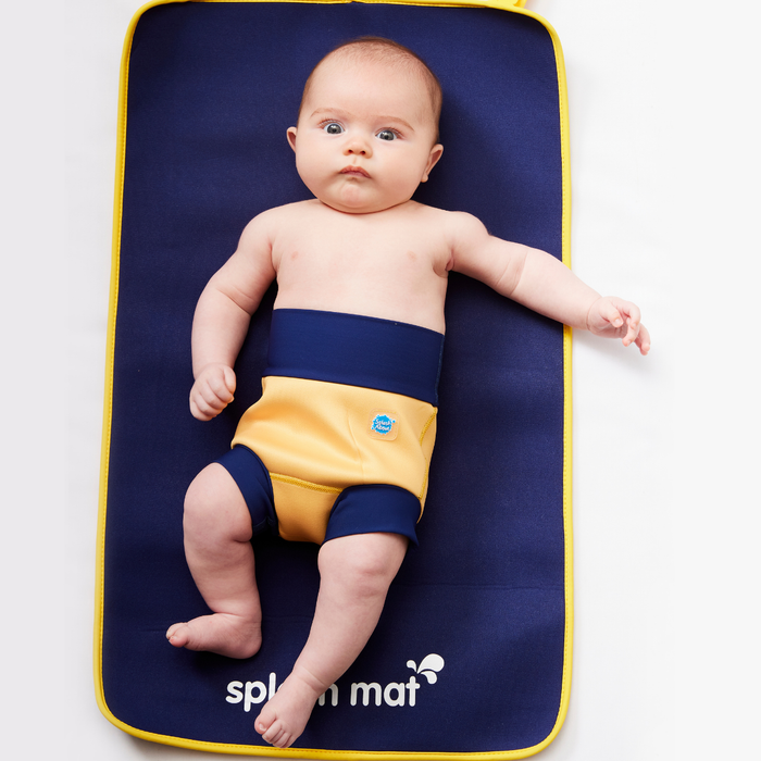 Child on neoprene mat