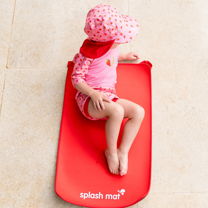 Child on neoprene mat