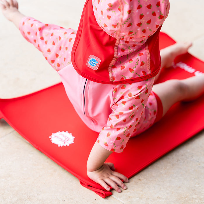 Child on neoprene mat