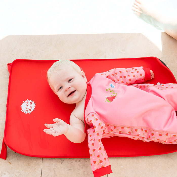 Child on neoprene mat