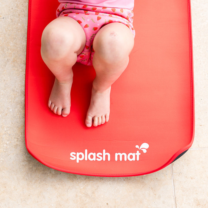 Child on neoprene mat