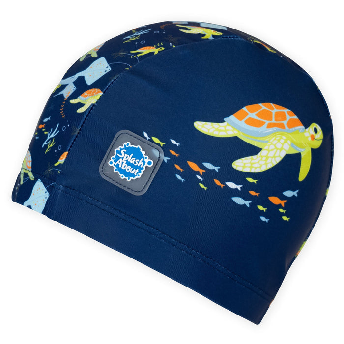 Baby swim hat in navy featuring turtles themed print.