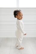 Loulou Lollipop Waffle Long Sleeve Bodysuit in Coconut Milk — front view on white background