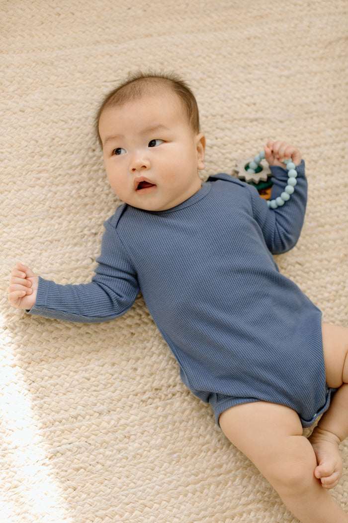 Loulou Lollipop Waffle Long Sleeve Bodysuit in Denim Blue — front view on white background