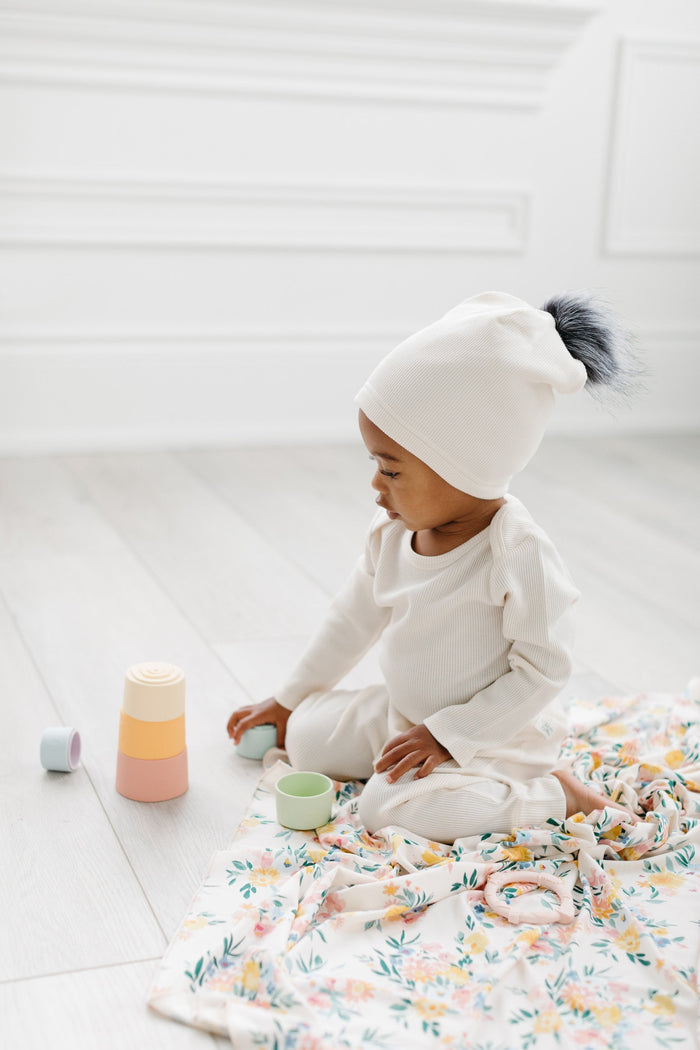 Loulou Lollipop Waffle Pom Pom Hat in Coconut Milk — front view on white background