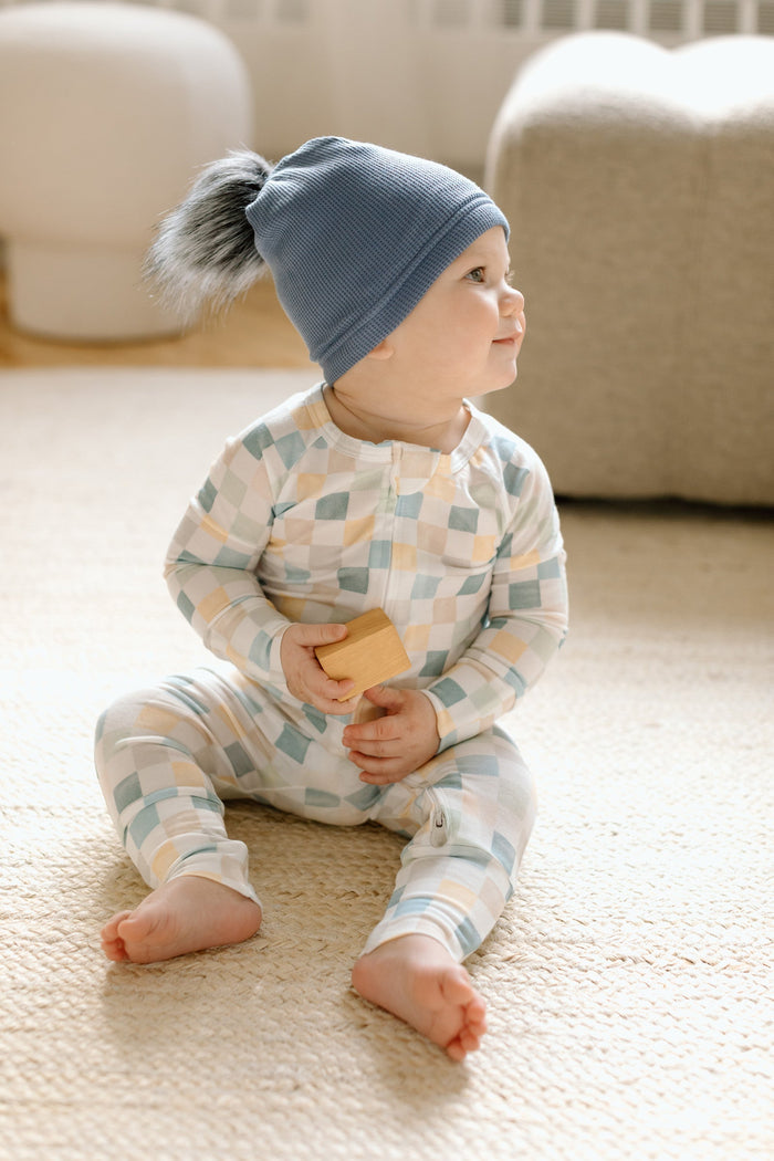 Loulou Lollipop Waffle Pom Pom Hat in Denim Blue — front view on white background